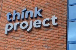 large channel letter sign installed on brick wall of building