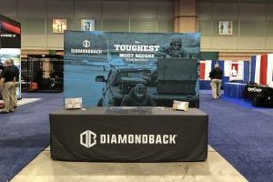 trade show booth with backdrop, custom printed table cloth and sales literature